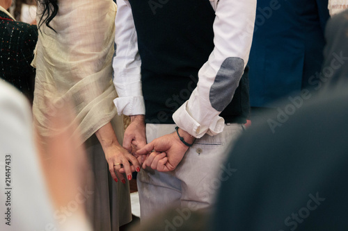 Couple discreetly holding hands