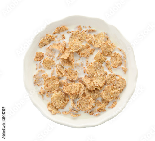 Bowl with flakes and milk on white background. Healthy grains and cereals