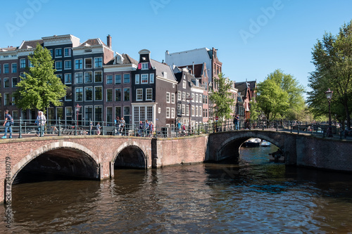 Amsterdam, The Netherlands, May, 2018: Beautiful and romantic view of the canals and typical houses from Unesco world heritage city.