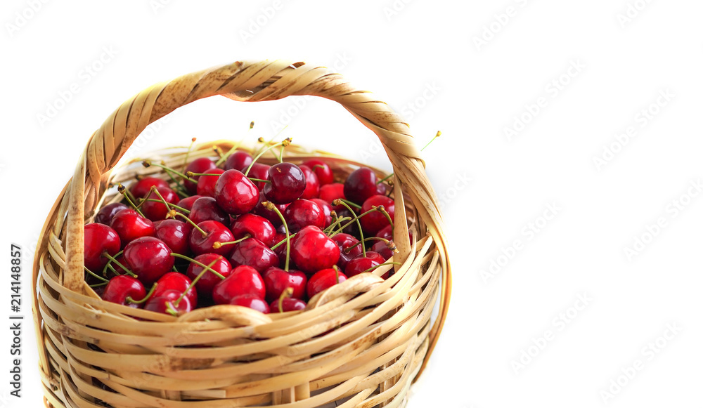 red cherries inside the wicker basket and isolated white background red cherries inside the wicker basket and isolated white background