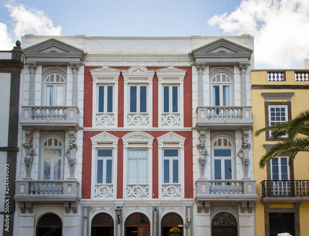 Front facade of historic buildings in Las Palmas city, Canary Islands. Colonial architecture style in Gran Canaria, Spain. Real estate, tourism vacation concepts