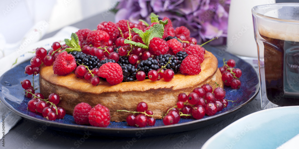 Homemade pastries with fruits and flowers hydrangea. The cake is decorated with various fresh berries and mint. Summer food. Sweet breakfast. Copy space, Homemade pastries with fruits and flowers hydrangea. The cake is decorated with various fresh berries and mint. Summer food. Sweet breakfast. Copy space,