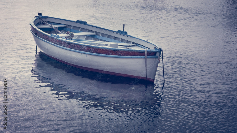 Naklejka premium Close up view of a small wooden boat float on the see. Summer in Zurkovo, Rijeka,Croatia.