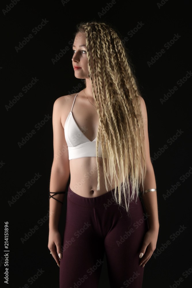 Fototapeta premium Blonde young woman dancing dancehall
