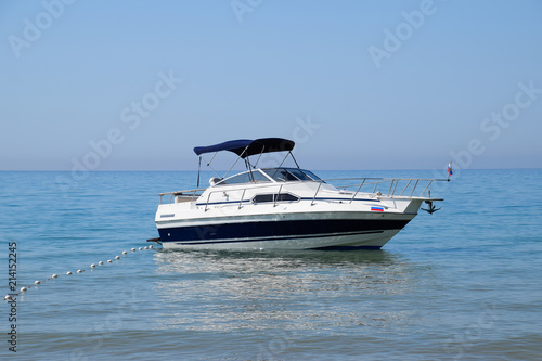 A small boat yacht in the sea near the shore © eleonimages