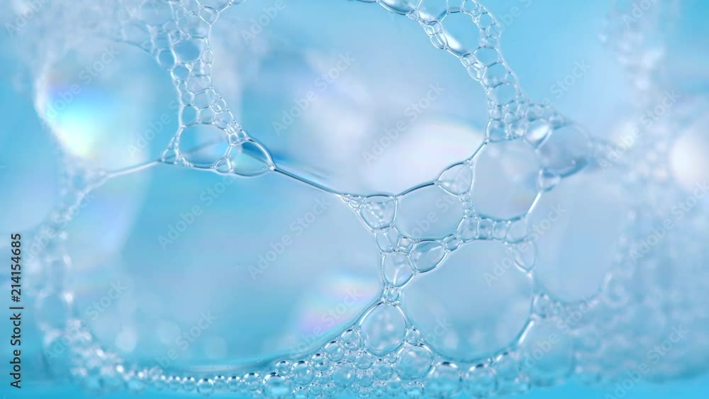 Foam. Soap foam popping bubbles background. Foam macro structure closeup. Washing concept. Slow motion 4K UHD video 3840x2160 Foam. Soap foam popping bubbles background. Foam macro structure closeup. Washing concept. Slow motion 4K UHD video 3840x2160