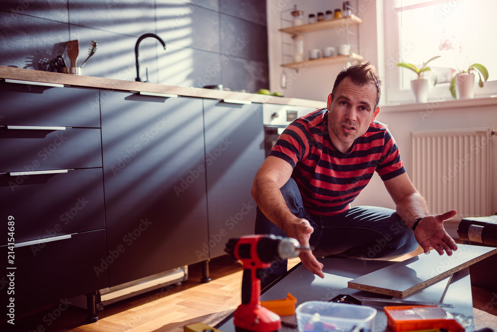 Man arguing about kitchen cabinet design Man arguing about kitchen cabinet design