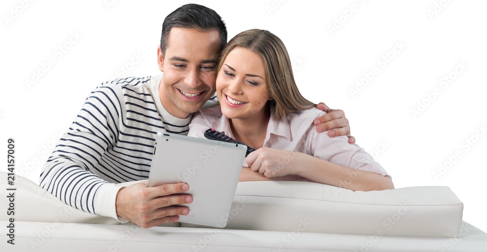 Smiling Couple Using a Tablet