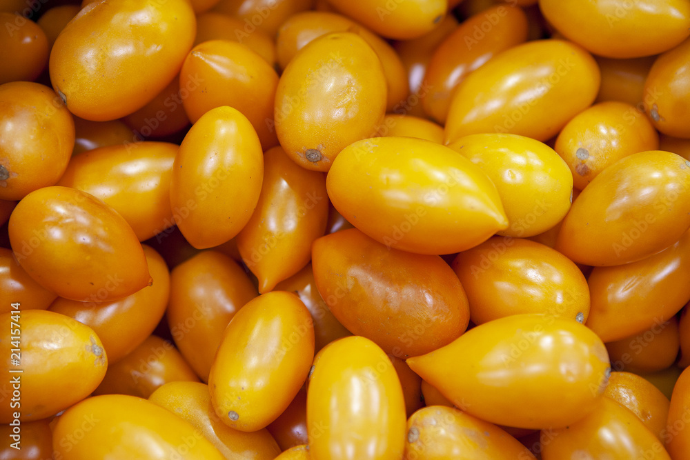 Heap of fresh ripe orange tomatoes without branches close up. Heap of fresh ripe orange tomatoes without branches close up.
