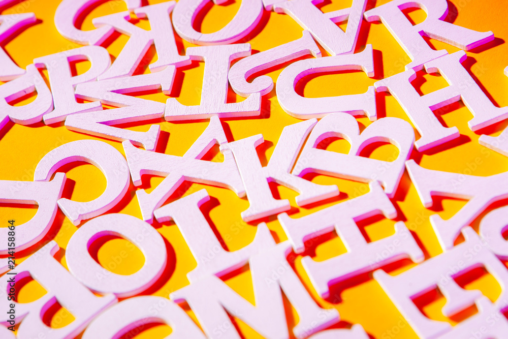 English font. Letters on a yellow background. White font. English font. Letters on a yellow background. White font.
