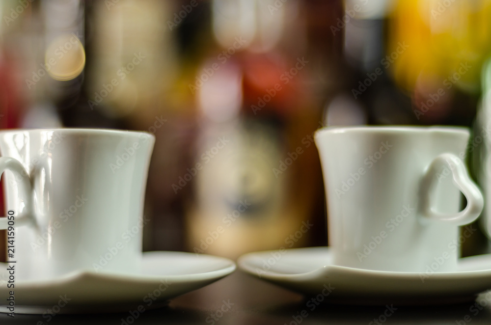 black coffee in a ceramic cup on the bar, energy drink in a public place black coffee in a ceramic cup on the bar, energy drink in a public place
