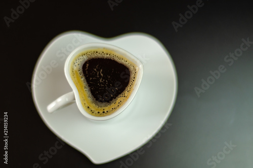 black coffee in a ceramic cup on the bar, energy drink in a public place © Q77photo