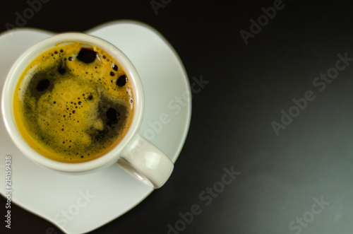 black coffee in a ceramic cup on the bar, energy drink in a public place