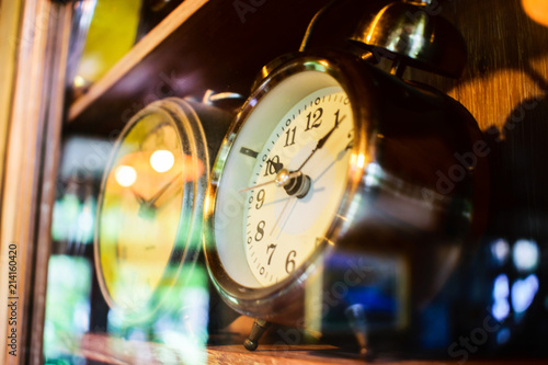 Vintage alarm clocks on the wood classic showcase.