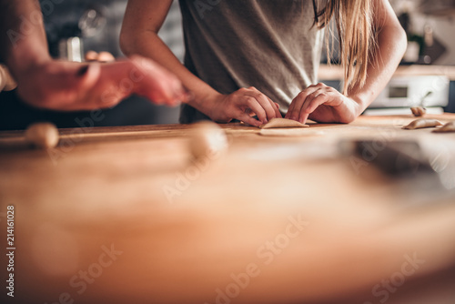 Wallpaper Mural Mother and daughter filling ravioli with chocolate cream Torontodigital.ca
