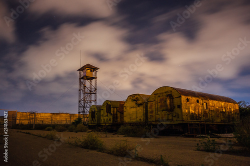 Fotografija Old army watchtower in abandoned military base at night