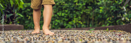 Bilde på lerret Boy Walking On A Textured Cobble Pavement, Reflexology