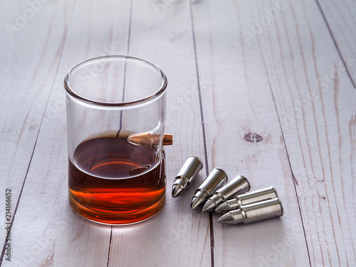 Whiskey glass with bullet