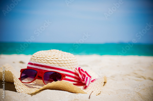 Summer vacation concept with accessories on sandy beach