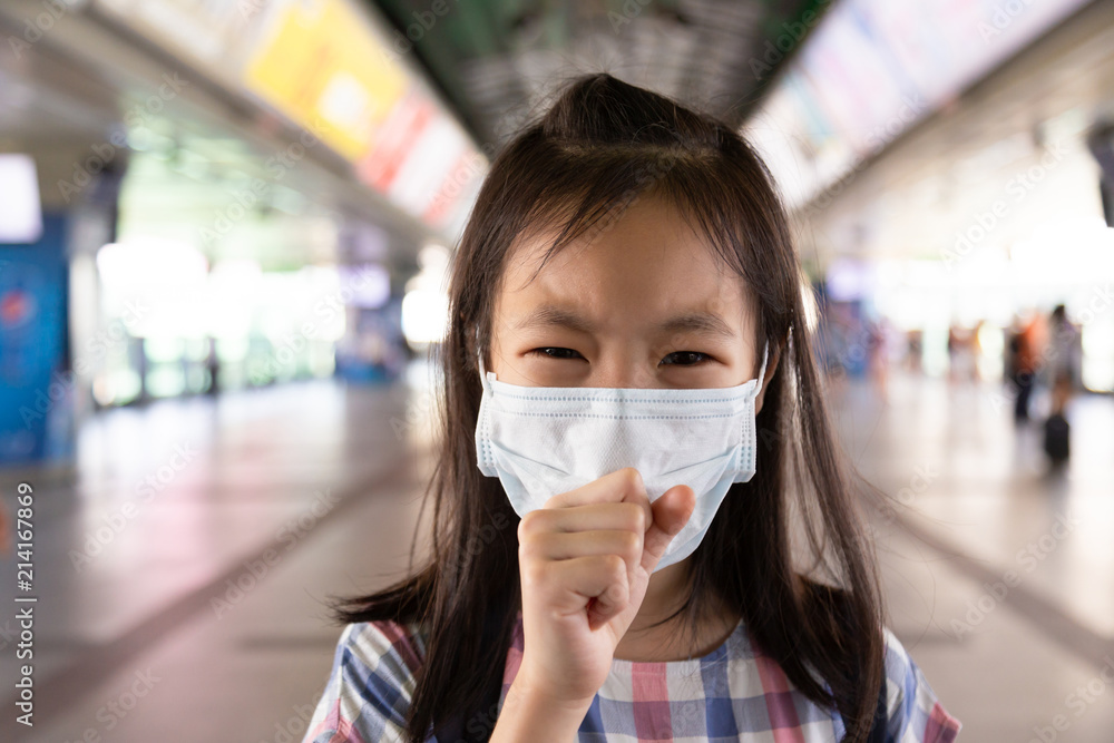 Asian girl suffer from cough with face mask protection,Sick girl with medical mask,health concept Asian girl suffer from cough with face mask protection,Sick girl with medical mask,health concept