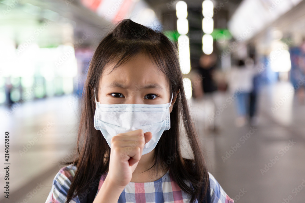 Asian girl suffer from cough with face mask protection,Sick girl with medical mask,health concept Asian girl suffer from cough with face mask protection,Sick girl with medical mask,health concept