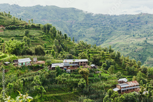 Arieal View of Beautiful Nepali Village sorrounded by the Green Forest,Mountain Village,Gorkha Nepal photo