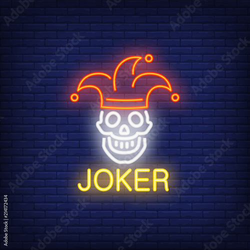 Joker neon sign. Lettering with smiling skull in joker cap. Night bright advertisement. Vector illustration in neon style for gambling, casino and poker club