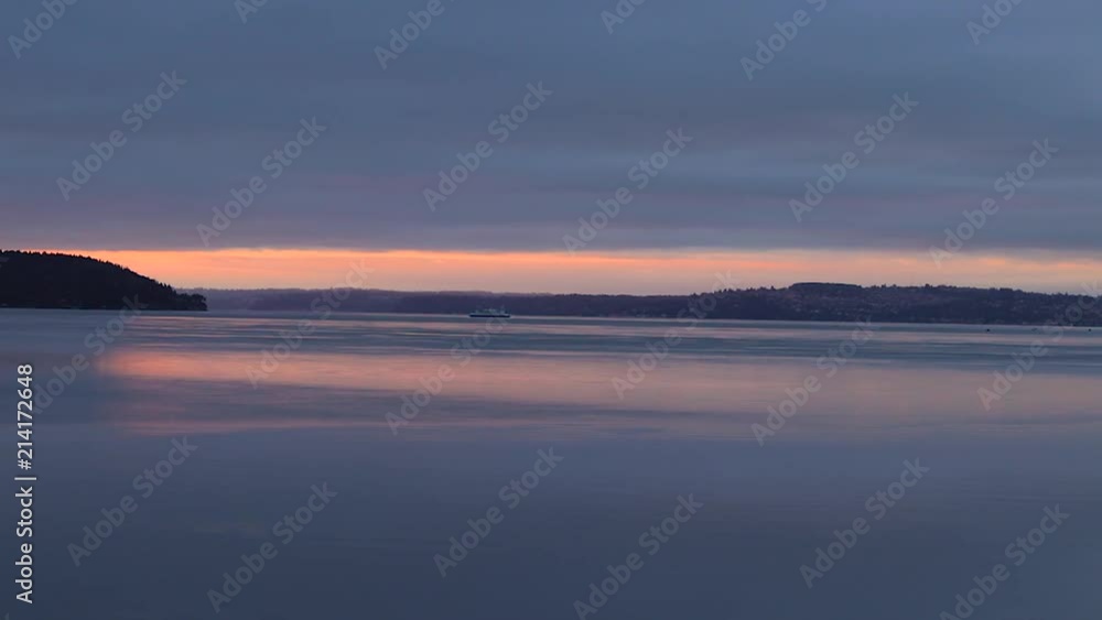 Large lake with a distant boat Large lake with a distant boat