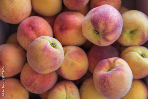 Close-up of box of ripe Okanagan peaches from local farm market