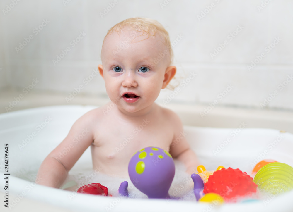 Baby playing in the bath Baby playing in the bath