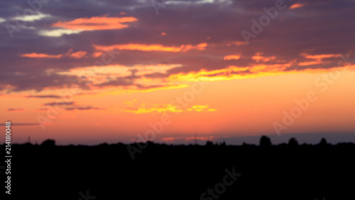 Beautiful sunset. Blurred image of the dramatic sunset in the steppes in the Astrakhan region. Russia. Dramatic clouds as a natural background. © as_trofey