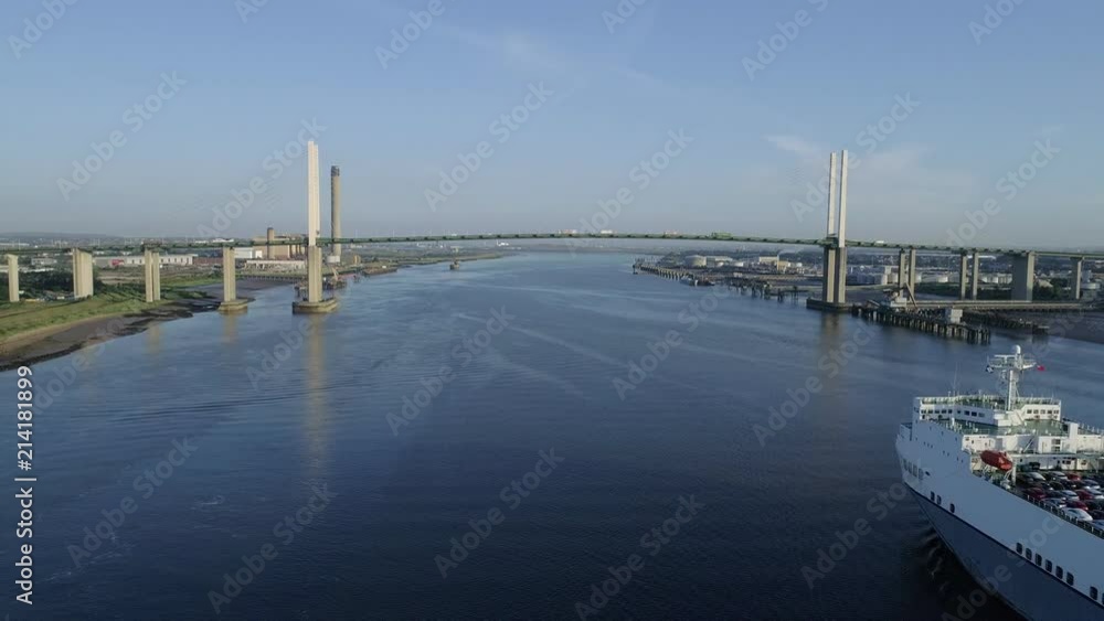 ro-ro cargo ship Victorine sails past drone over River Thames. The QEII Bridge is in the background ro-ro cargo ship Victorine sails past drone over River Thames. The QEII Bridge is in the background