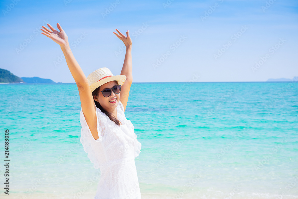 Happy woman enjoying beautiful sunset on the beach. Relaxing concept Happy woman enjoying beautiful sunset on the beach. Relaxing concept