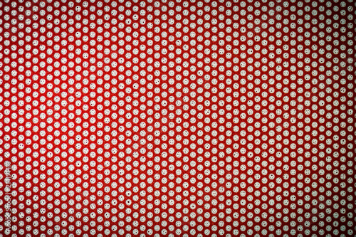 Perforated film on advertising production sealed in red, with ink drops inside the perforation