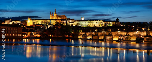 View to Prague castle across Vltava river, beautiful evening panorama © e_polischuk
