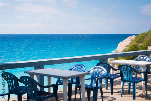 Empty tables taverna with sea view
