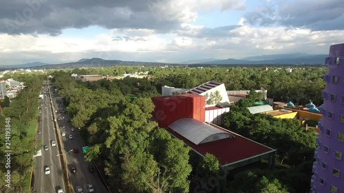 Hovering over Río Churubusco on a very clear day with views to the east of the city. photo