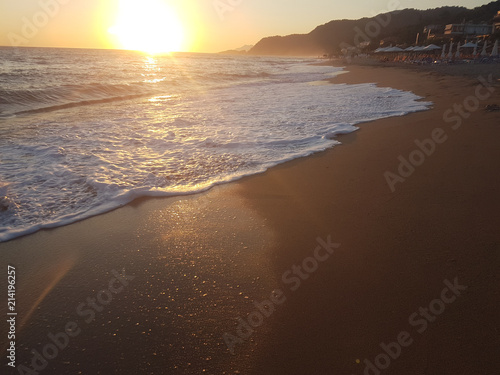 sunset sea waves foam splash  in summer Preveza Vrahos Greece