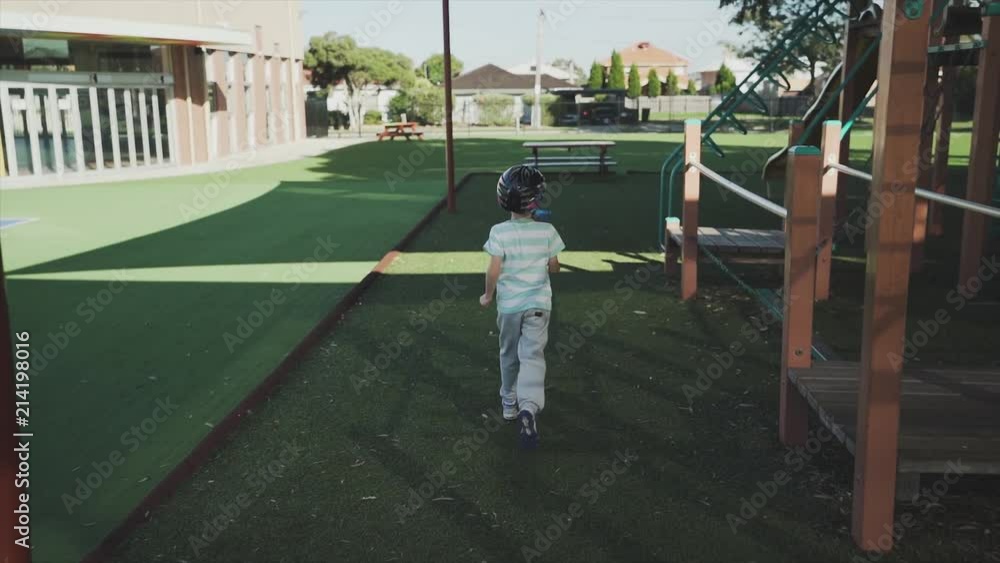 Child running and climbing in slow motion at a play ground on a sunny day Child running and climbing in slow motion at a play ground on a sunny day