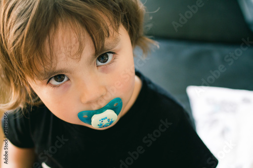Little with a pacifier photo