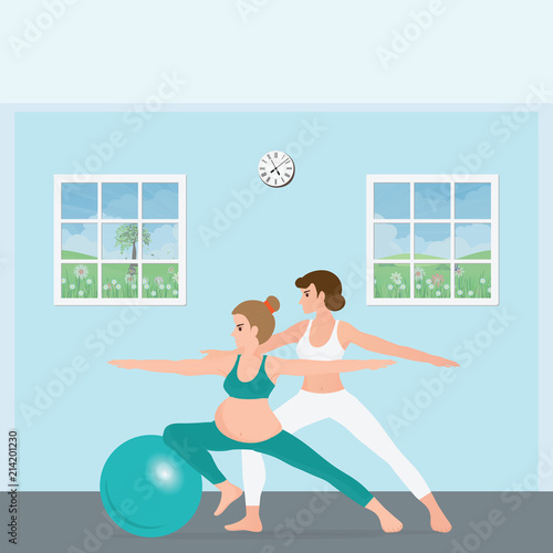 Pregnant woman doing yoga with a trainer.
