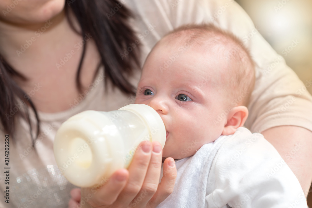 Baby drinking milk from feeding bottle Baby drinking milk from feeding bottle