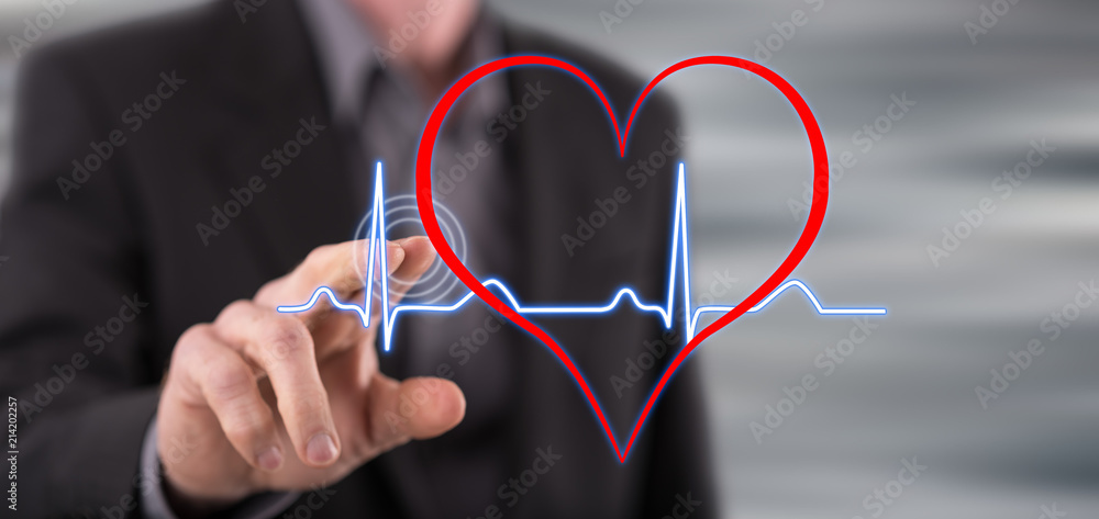 Man touching a heart beats graph Man touching a heart beats graph