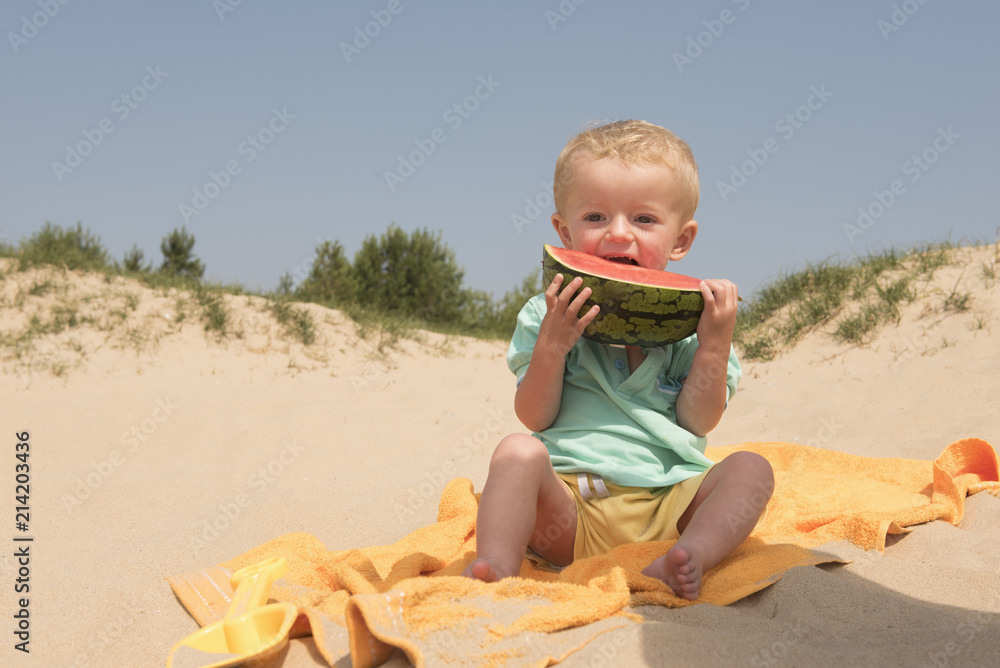 Two year old boy eating watermelon in summer Two year old boy eating watermelon in summer