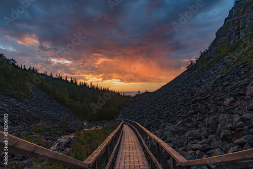 sunrise over a footbridge in fulufjallet national park Sweden
