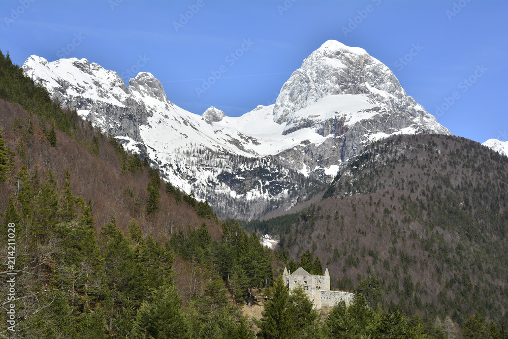 Mangart in the Slovenian Alps in April. Viewed from Lake Predil or Lago del Predil in Friuli, Italy
