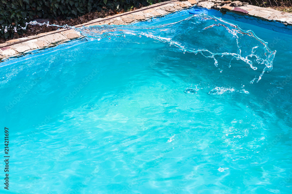 splashing of disinfectant in outdoor swimming pool