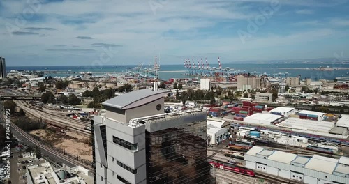 Aerial footage of Haifa City down town in summer time, with a beautiful Modern glass building. photo