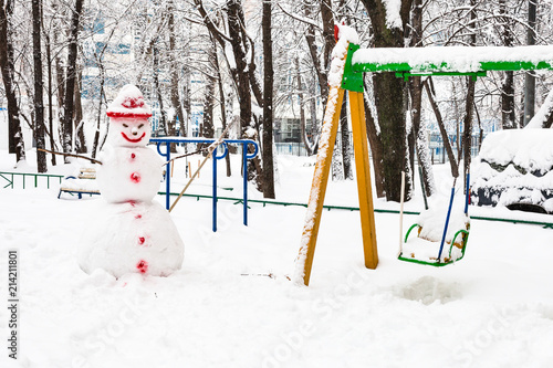 snowman at public playground in winter