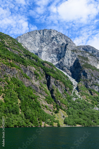 View of the high  1700 m  shore of Neroyfjord. Neroyfjord offshoot of Sognefjord is the narrowest fjord in Europe. Hardaland  Norway  Europe.